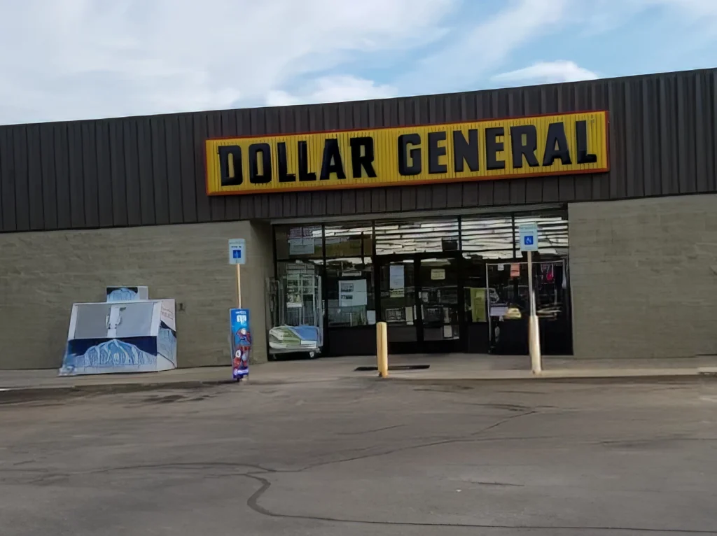 Exterior of a Dollar General store with a parking lot in front.