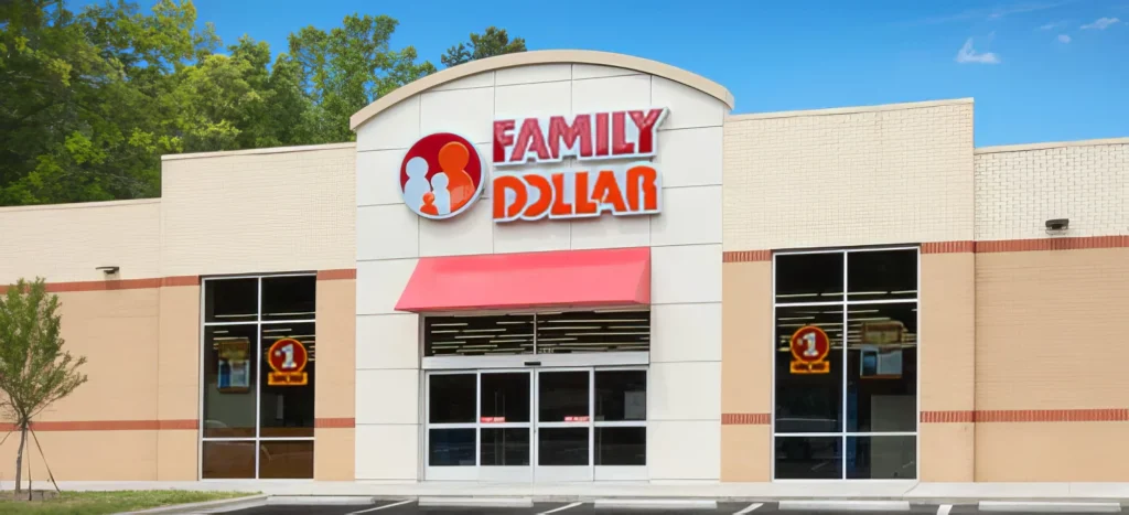 Front view of a Family Dollar store with a red awning and large windows.